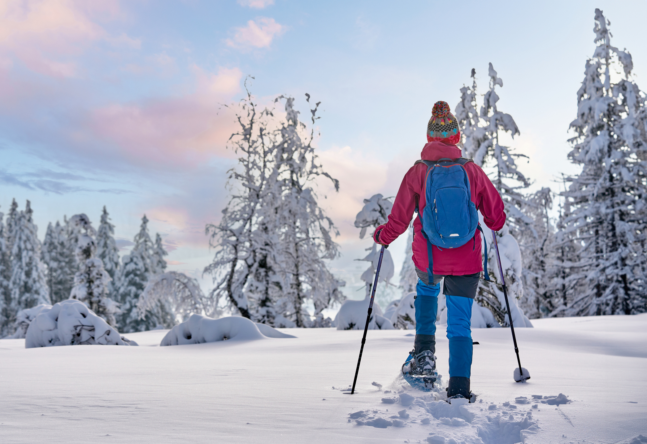 woman with snowshoes in the Bregenz Forest, Austrian Alps
